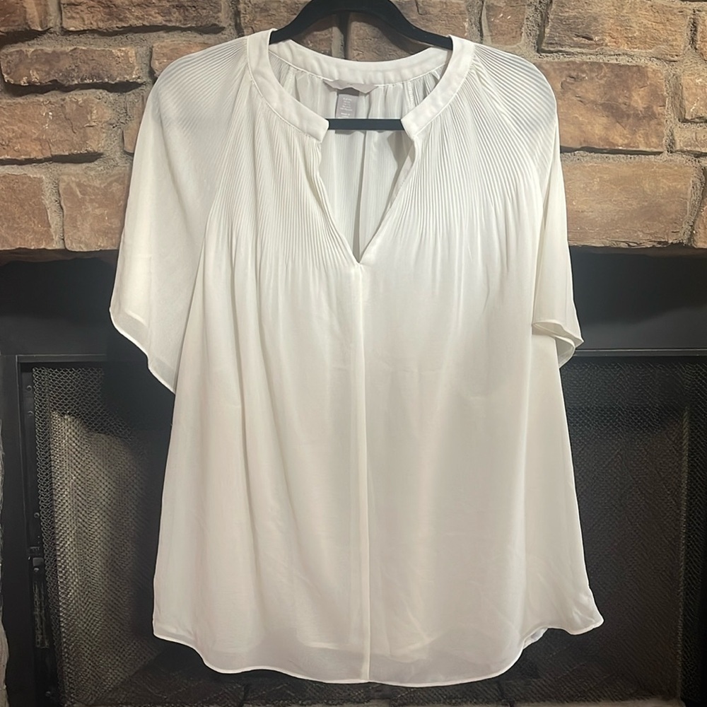 White lined blouse with sheer sleeves. Size is XXL